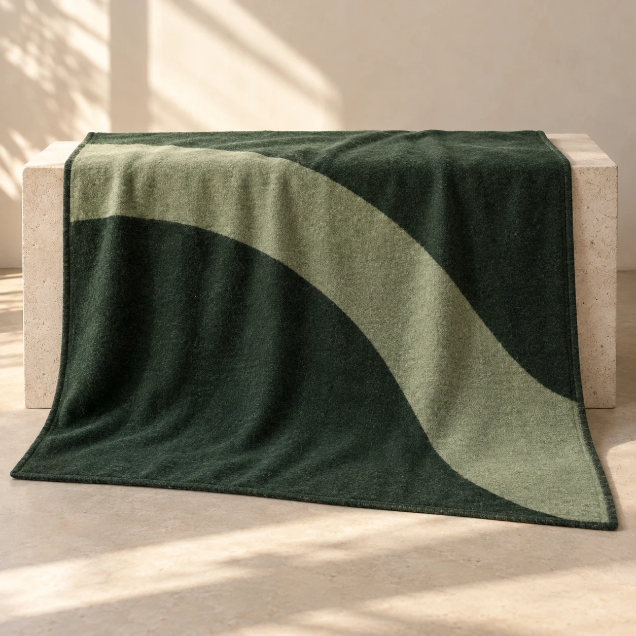 Forest Curve wool-blend throw — Forest / Sage; a sweeping sage arc across a forest-green field