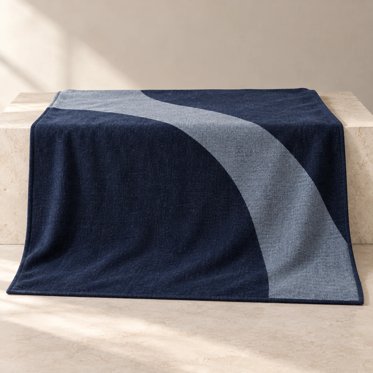 Midnight Curve wool-blend throw — Ink / Gray Blue; a sweeping gray-blue arc across an ink-blue field